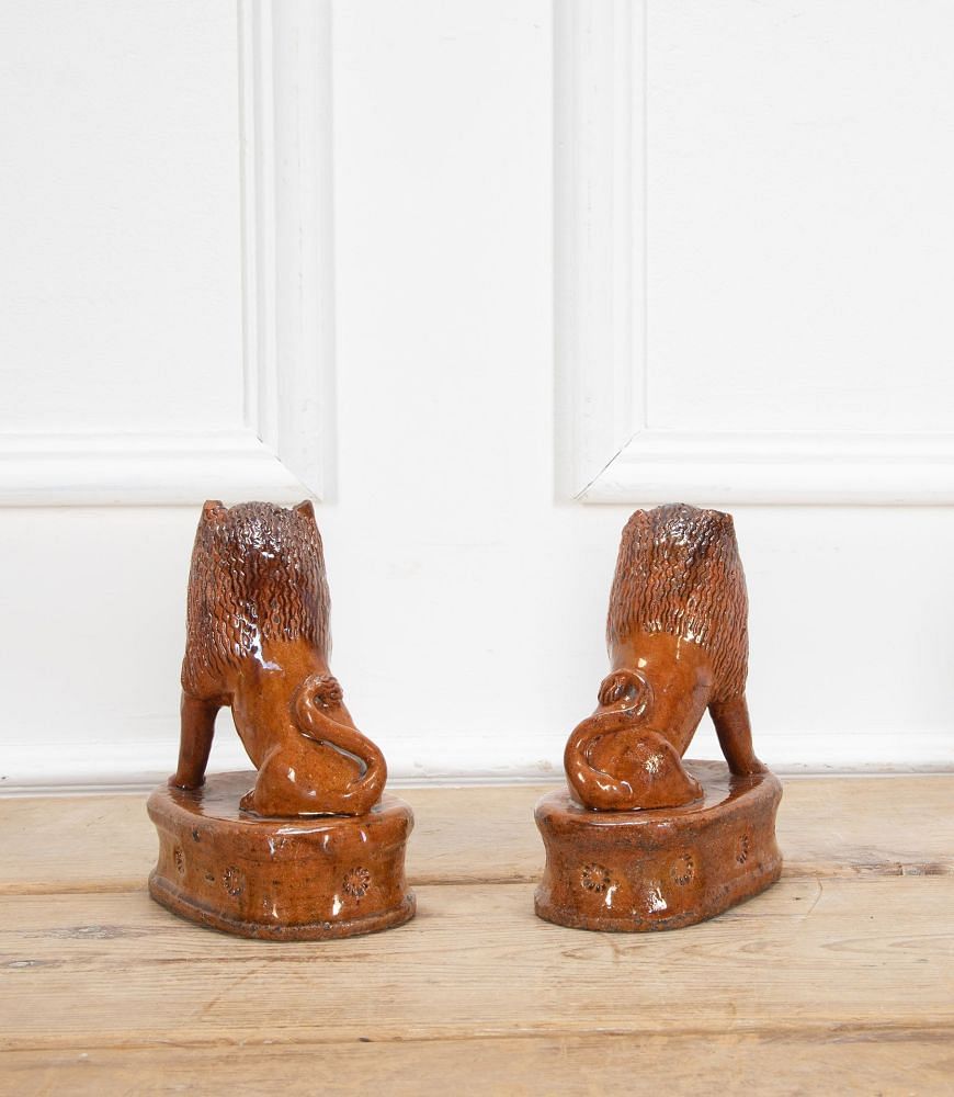 Pair of Early 20th Century English Terracotta Treacle Glazed Staffordshire Lions DA3438703