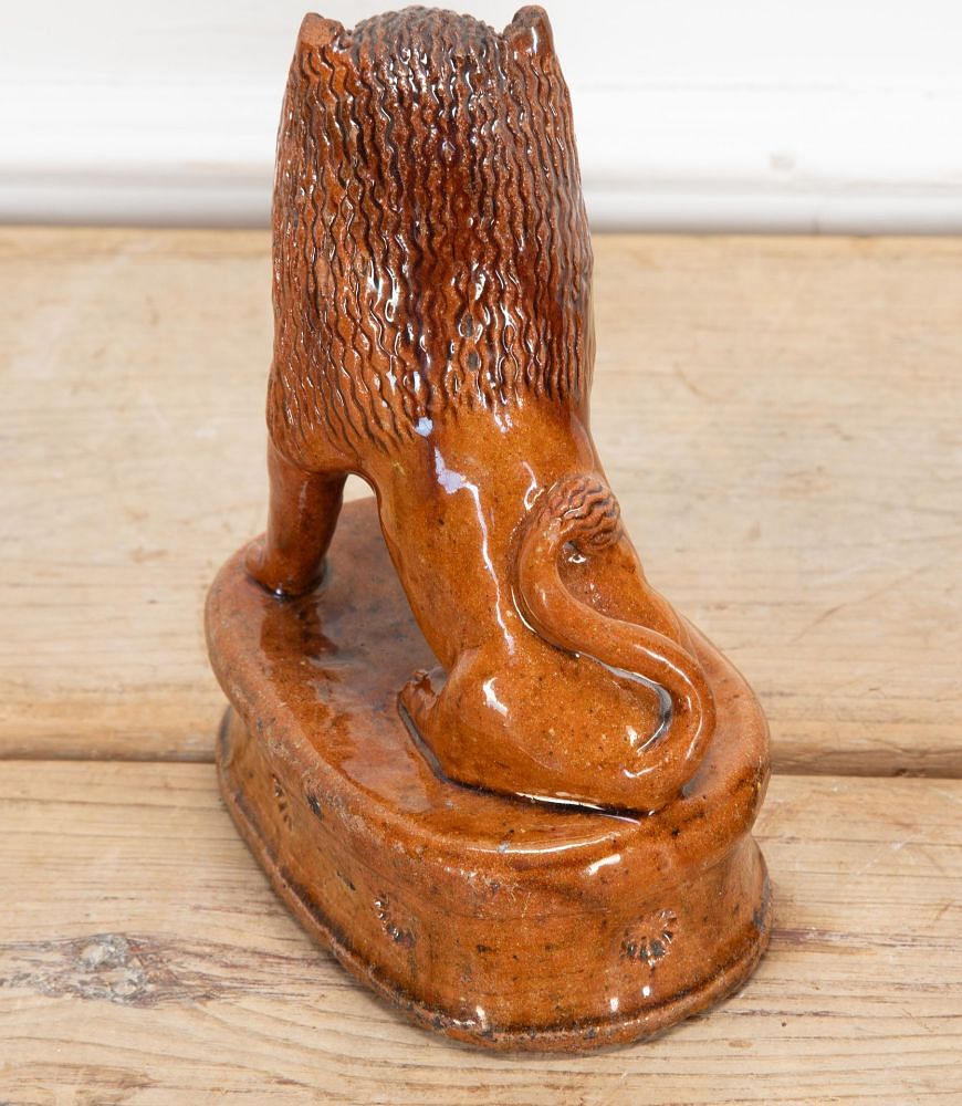 Pair of Early 20th Century English Terracotta Treacle Glazed Staffordshire Lions DA3438703