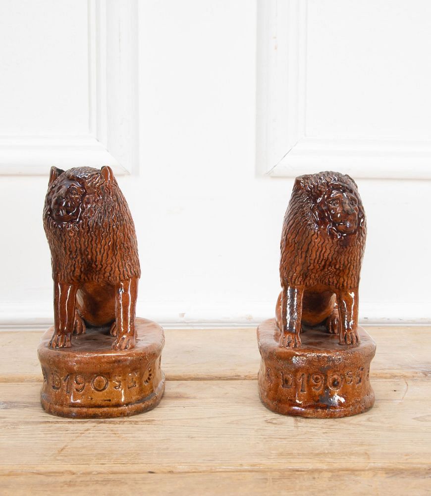 Pair of Early 20th Century English Terracotta Treacle Glazed Staffordshire Lions DA3438703