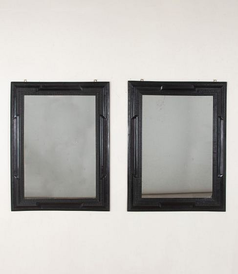 Pair of 20th Century Spanish Ebonised Ripple Moulded Mirrors