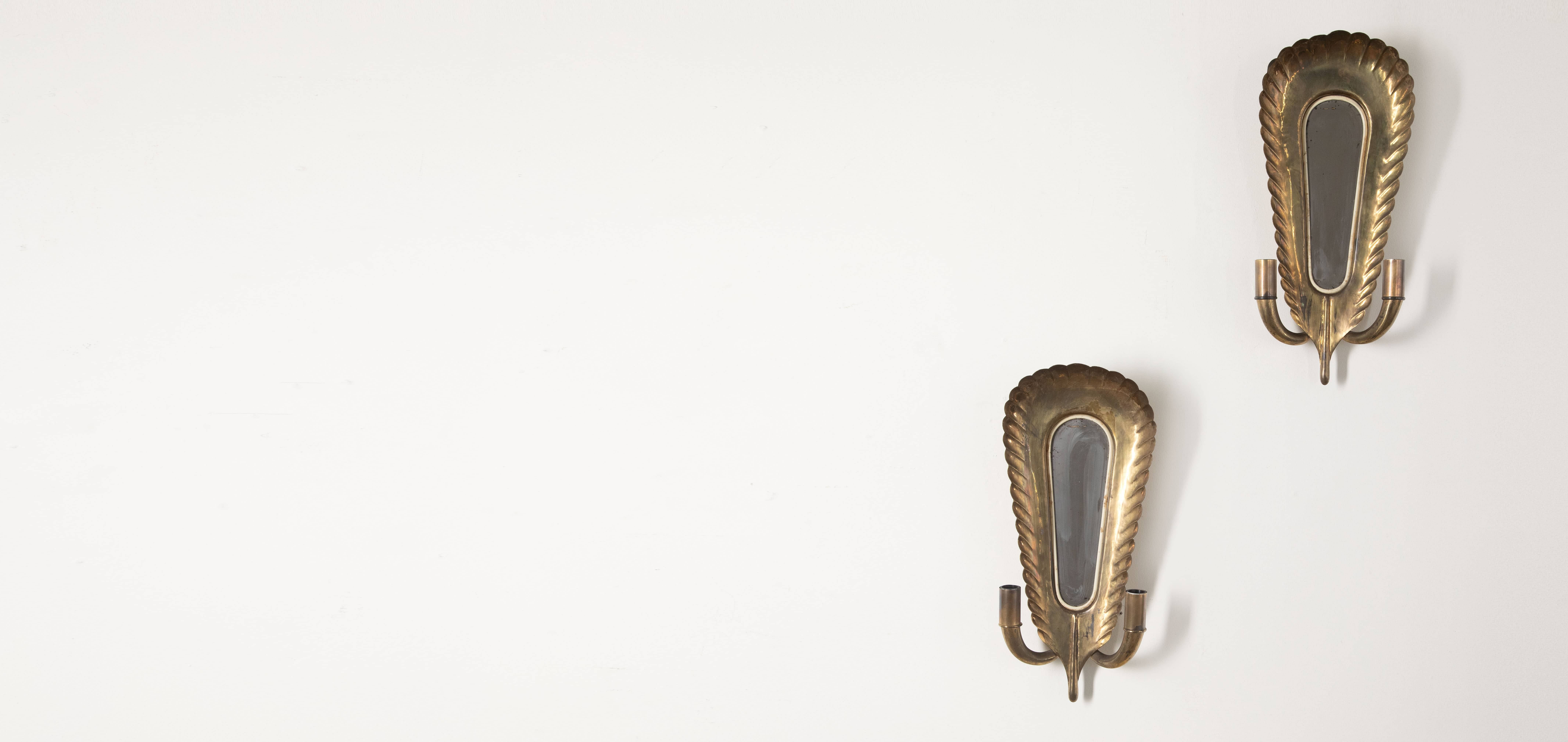 Pair of gold wall sconces.