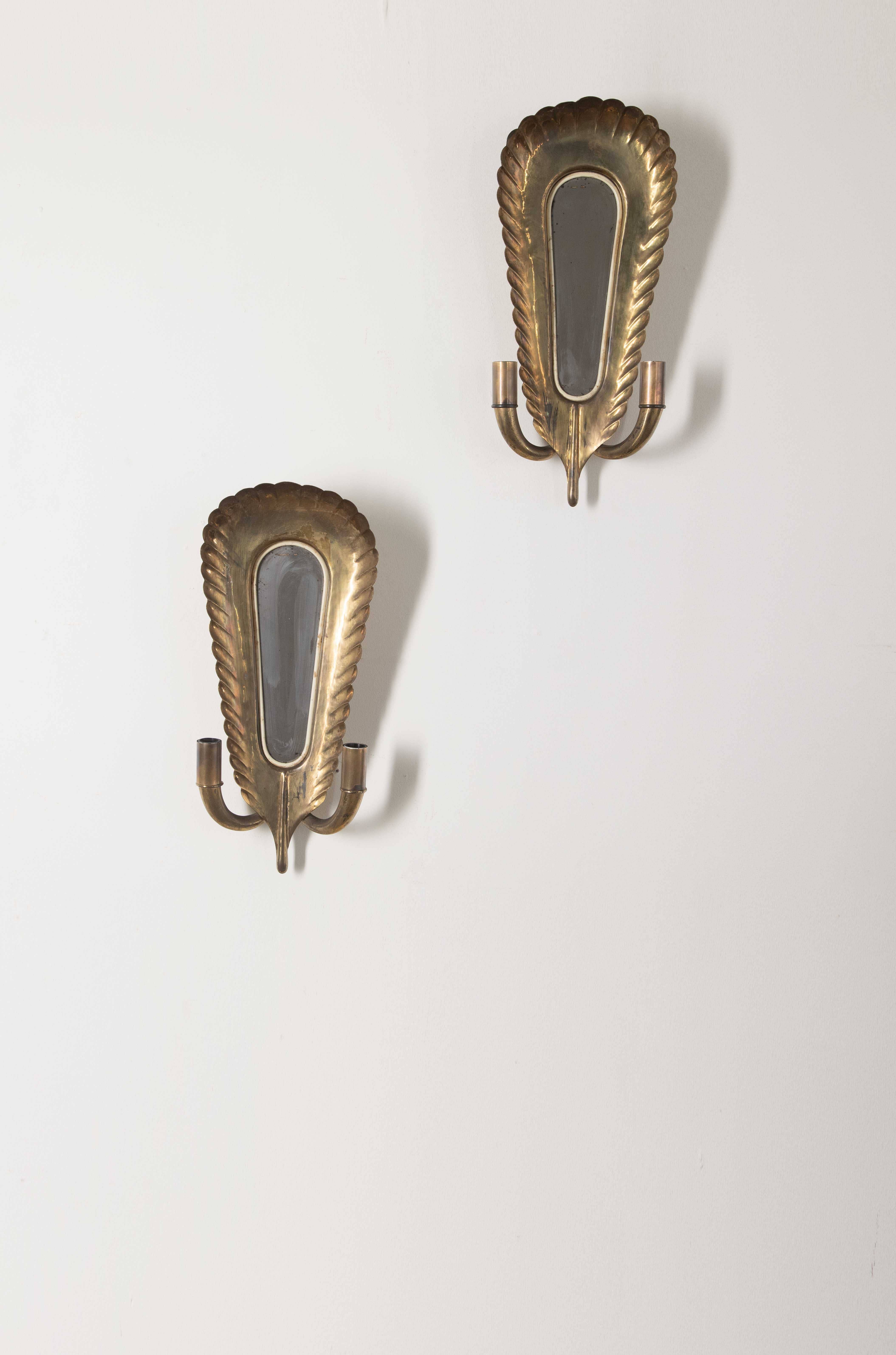 Pair of gold wall sconces.